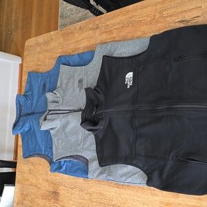 Lot of mens north face vests